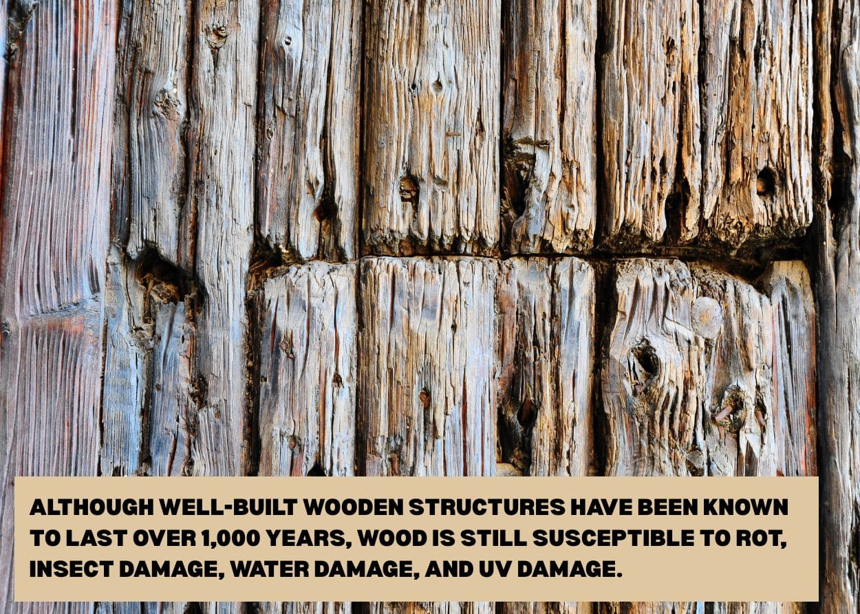 Weathered timber boards showing signs of aging, rot, and surface damage on a timber frame structure. Caption: Although well-built wooden structures have been known to last over 1,000 years, wood is still susceptible to rot, insect damage, water damage, and UV damage.