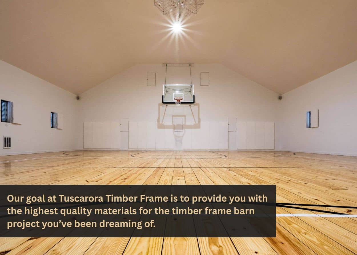 Indoor gymnasium with polished wooden floor and high timber-style ceiling.